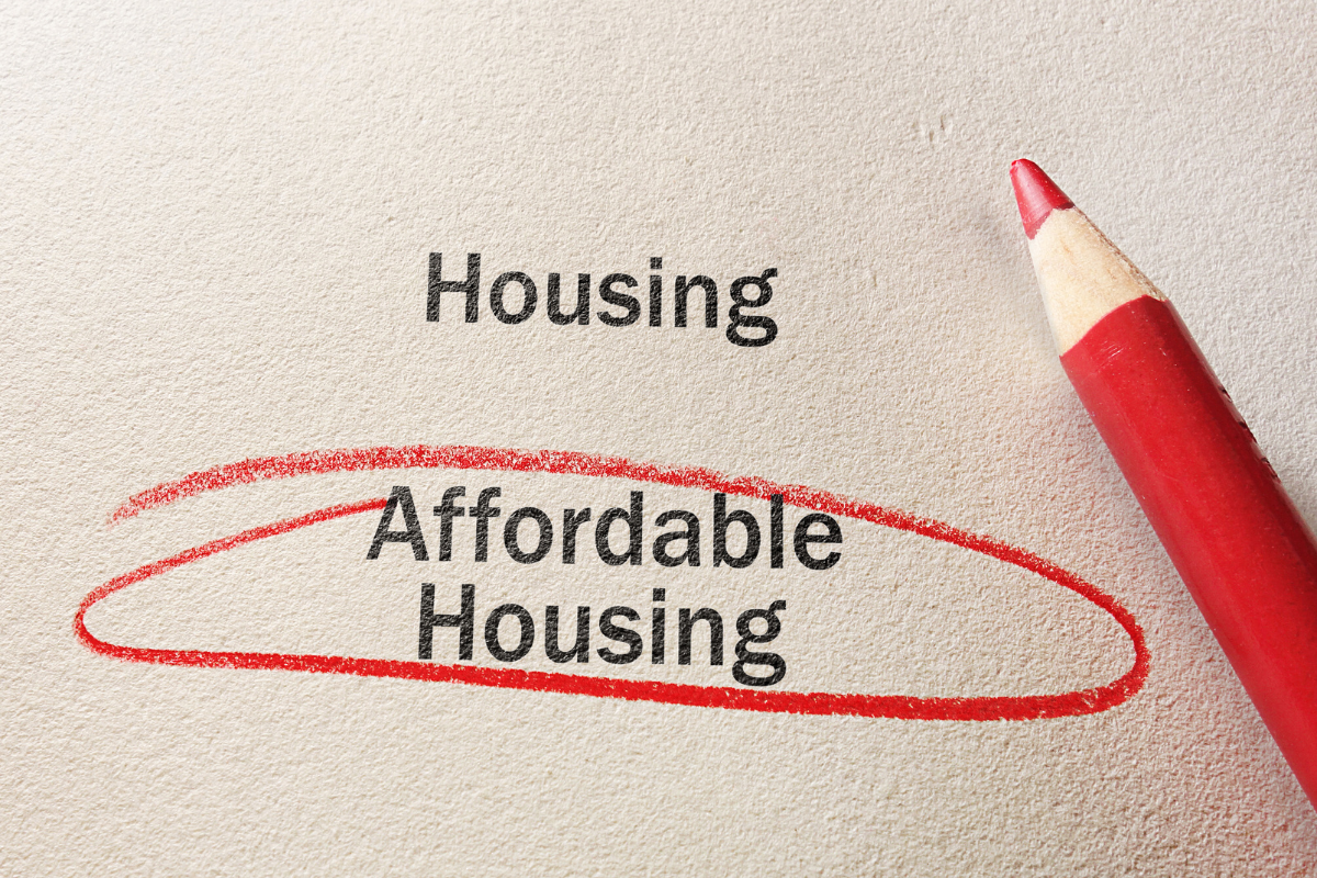 Piece of paper with affordable housing written on it in red pencil